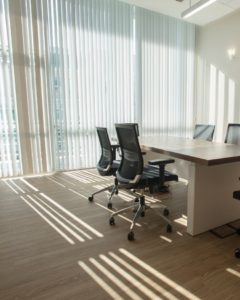 Empty desks and chairs in an office room