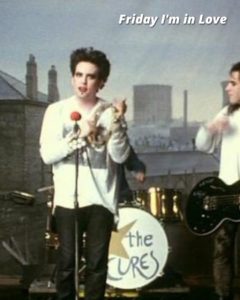 Still of The Cure performing 'Friday I'm in Love'