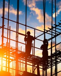 Two men on scaffolding on a construction site